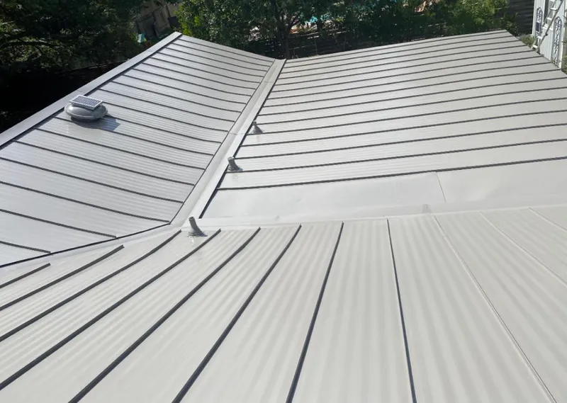 Solar attic fan installed on a metal roof for Roof Ventilation in Vestavia Hills